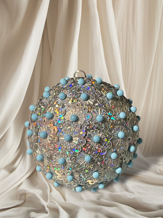 Holographic silver sequin ornament with larger blue pins 2.5”