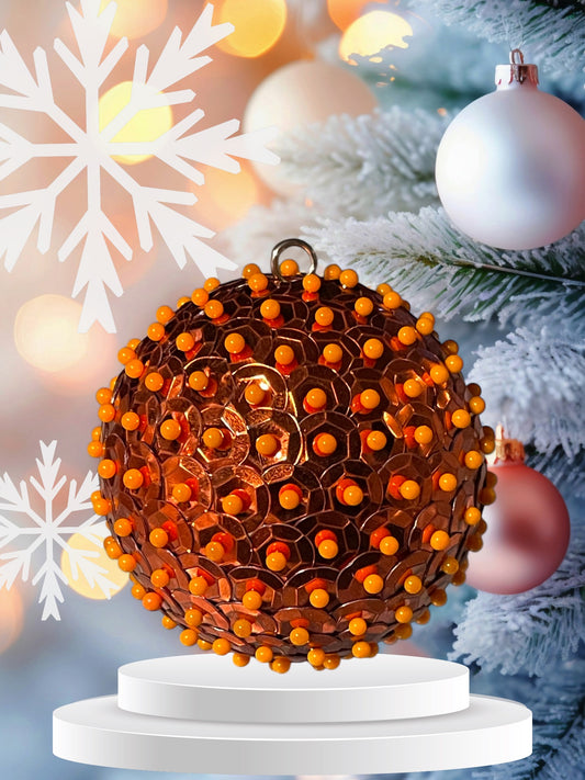 Orange metallic sequin ornament with orange pins 2.5”